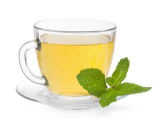 Fresh green tea in glass cup, mint and saucer isolated on white