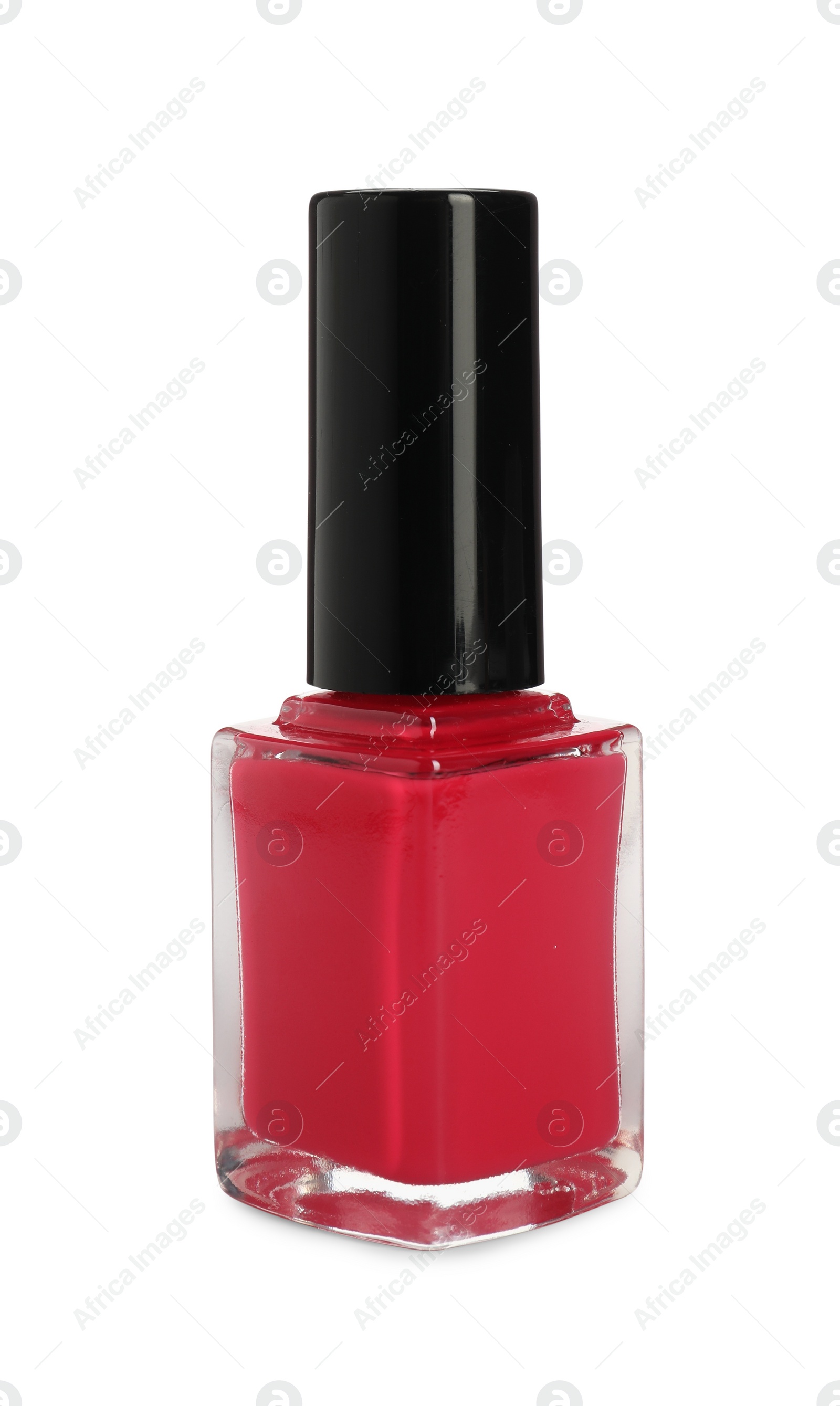 Photo of Red nail polish in bottle isolated on white