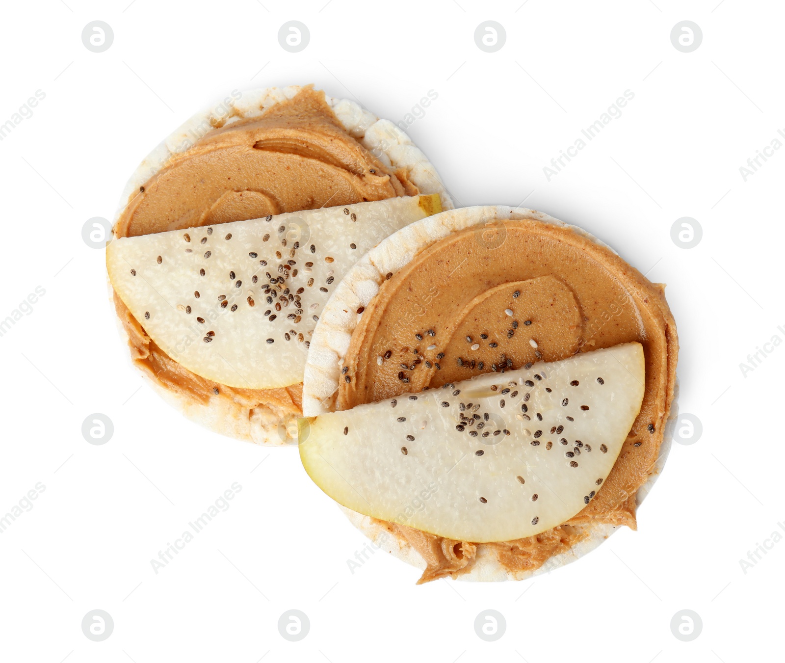 Photo of Puffed rice cakes with peanut butter and pear isolated on white, top view