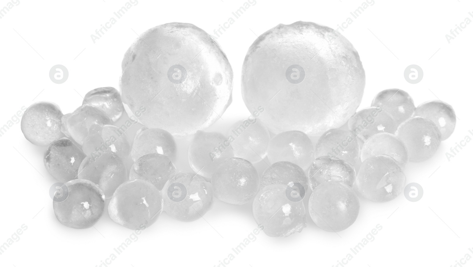 Photo of Many frozen ice balls on white background