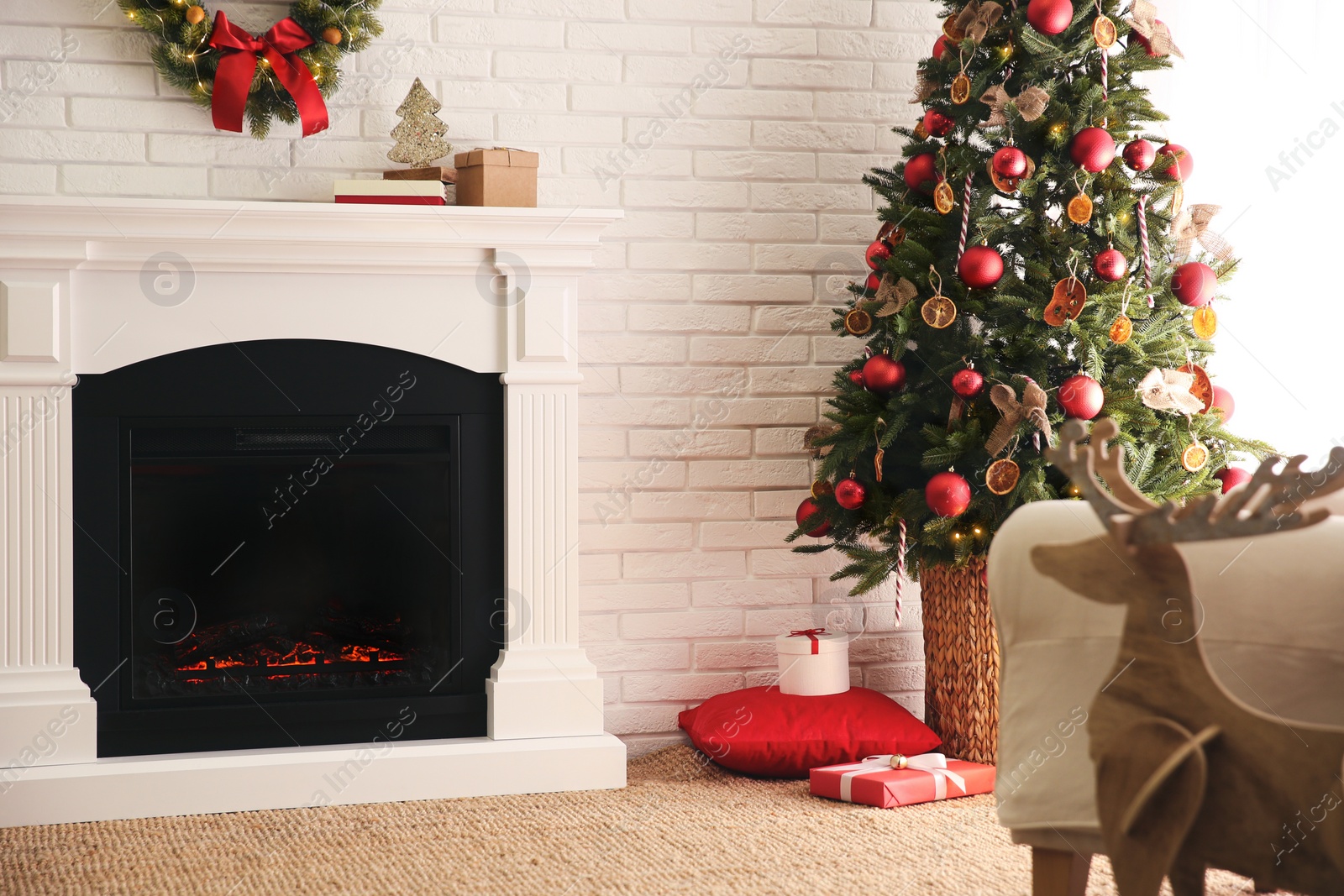 Photo of Beautiful living room interior with decorated Christmas tree and modern fireplace