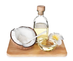 Photo of Composition with natural organic oil, ripe coconut and flower isolated on white