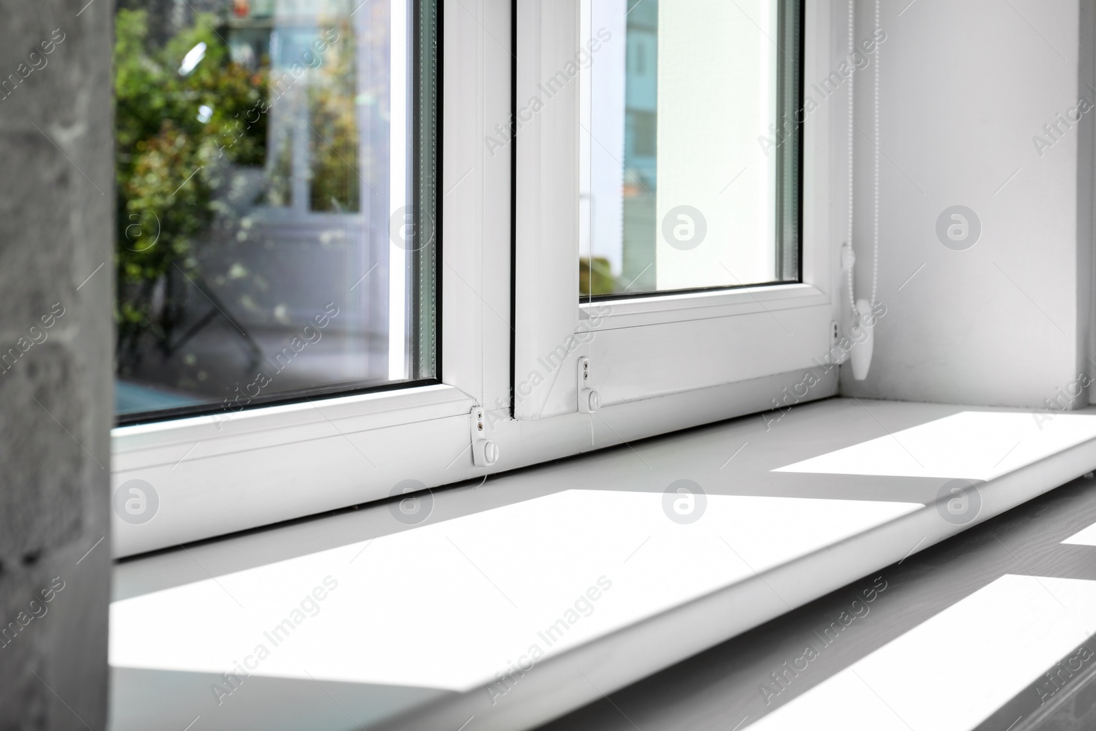 Photo of Modern window indoors, closeup view. Home interior