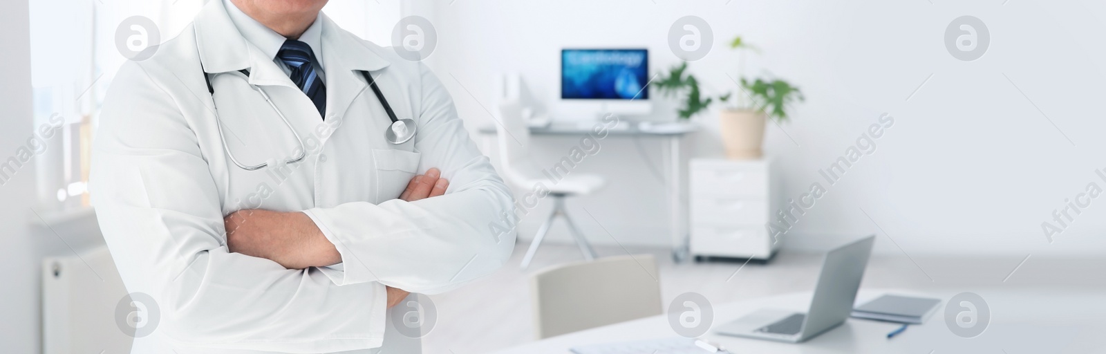 Image of Doctor in uniform at workplace in clinic, space for text. Banner design