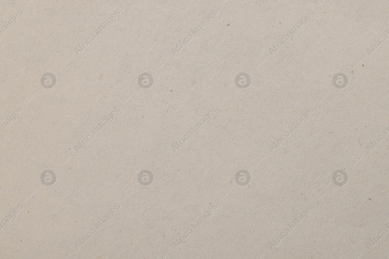 Photo of Texture of light grey paper sheet as background, top view