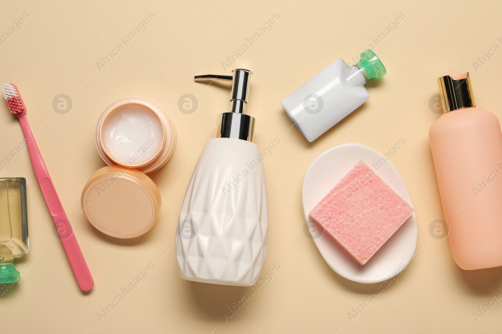 Photo of Bath accessories. Flat lay composition with personal care products on beige background