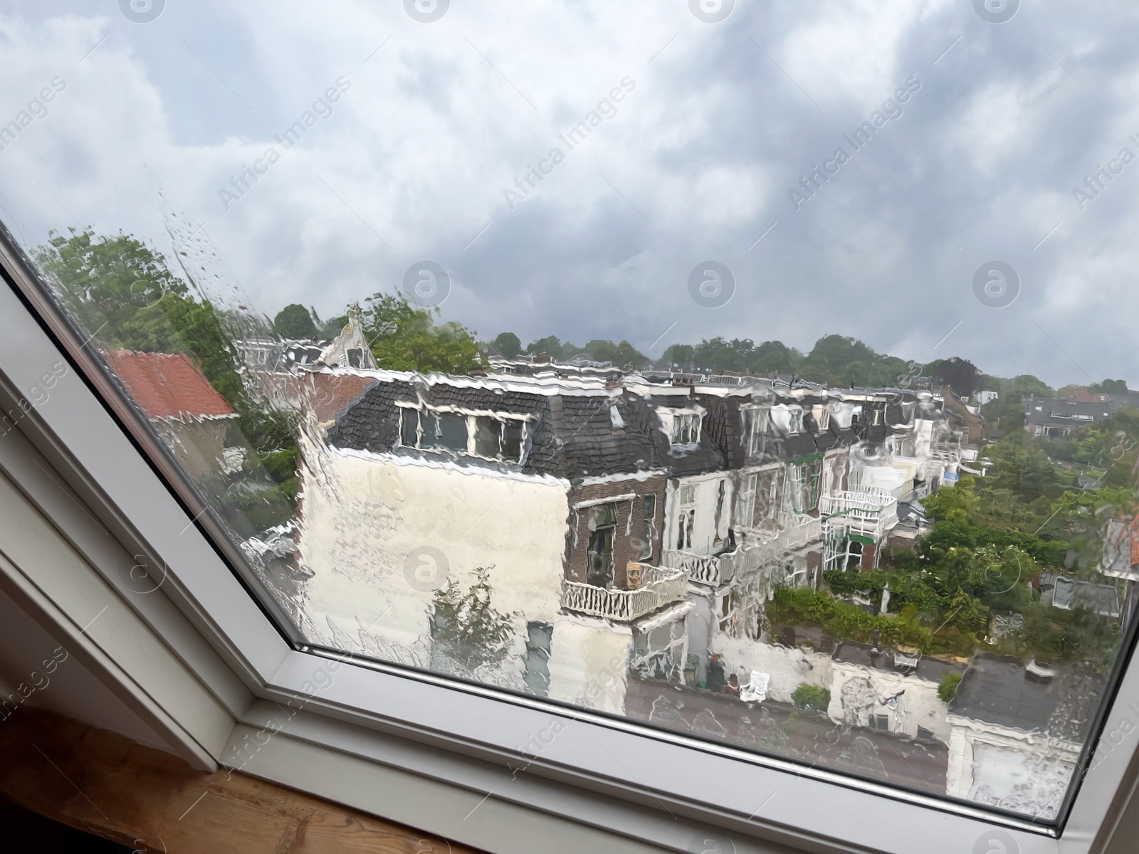 Photo of Window glass with water drops, view from inside. Rainy weather