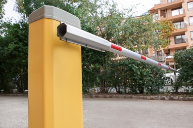Photo of Closed automatic boom barrier on autumn day outdoors