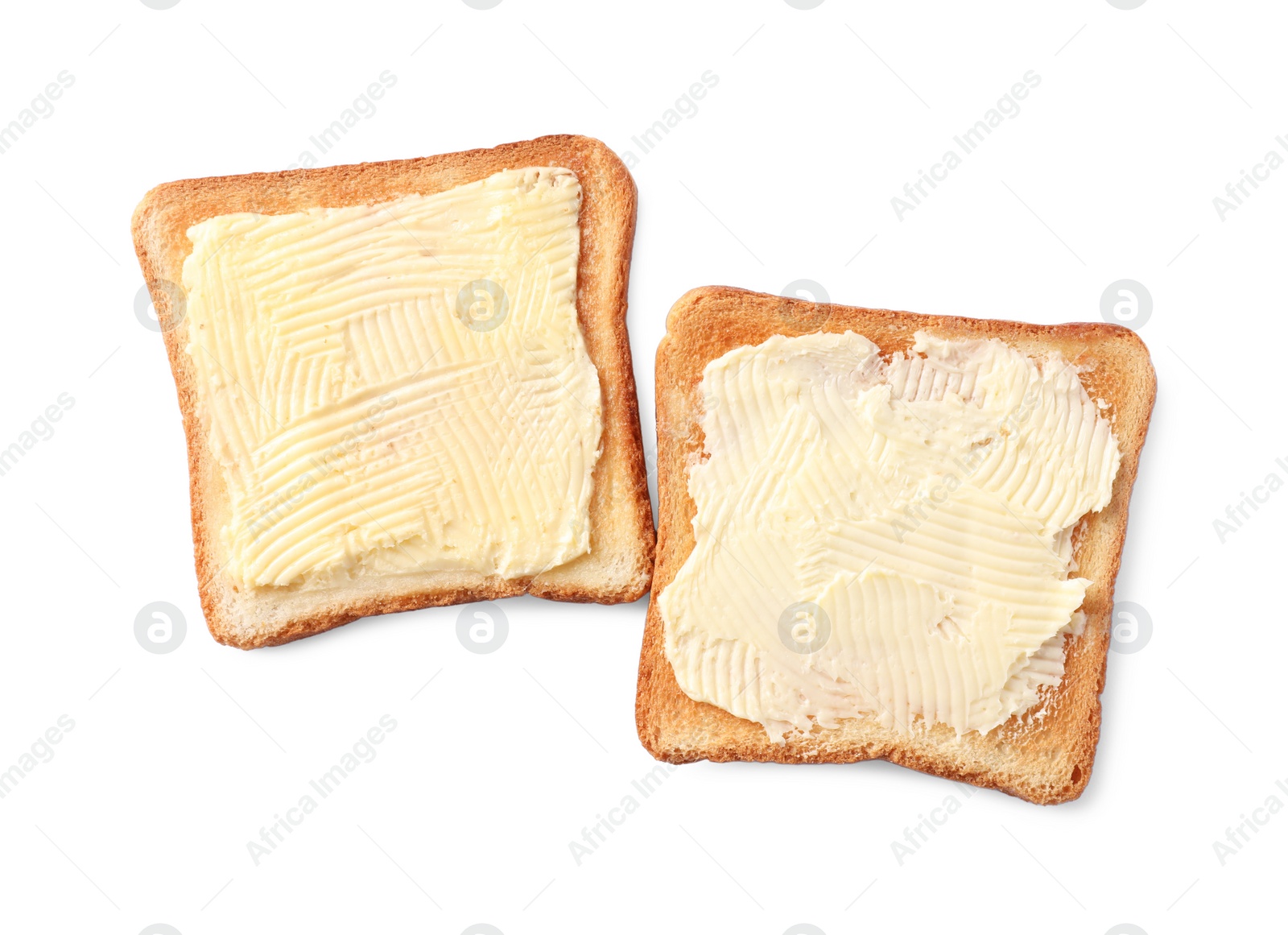 Photo of Tasty toasts with butter on white background, top view