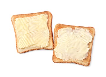 Photo of Tasty toasts with butter on white background, top view