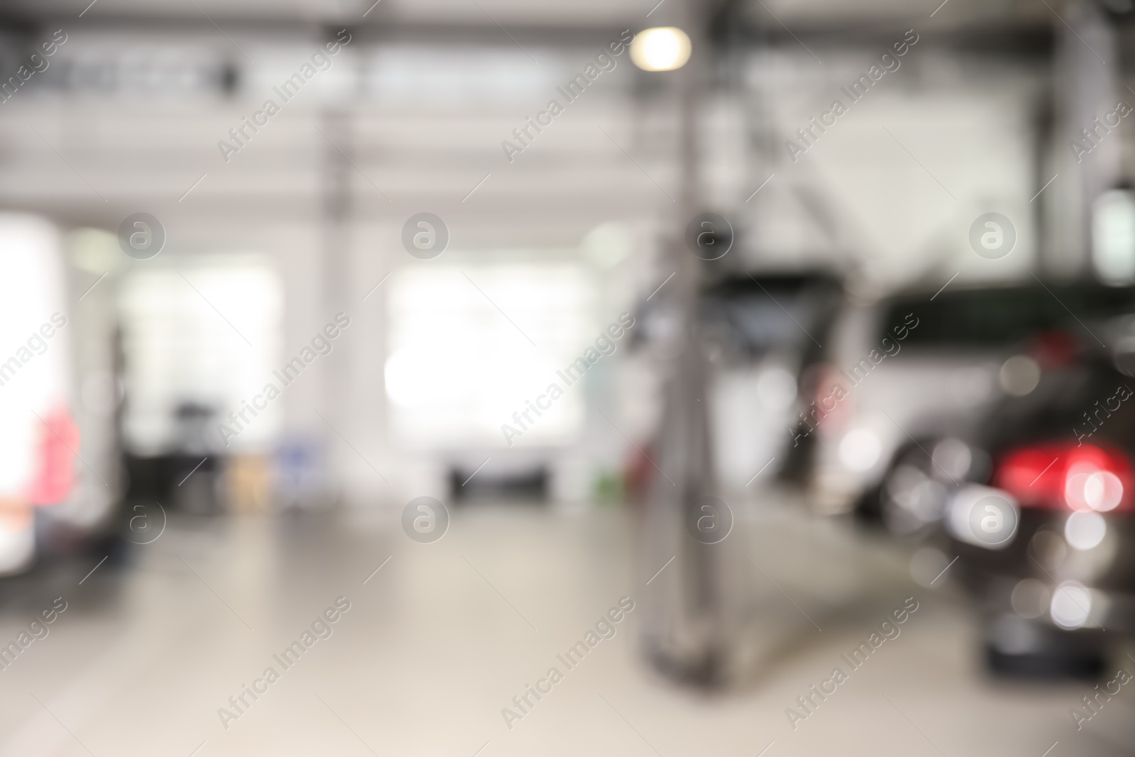 Photo of Blurred view of modern automobile repair shop