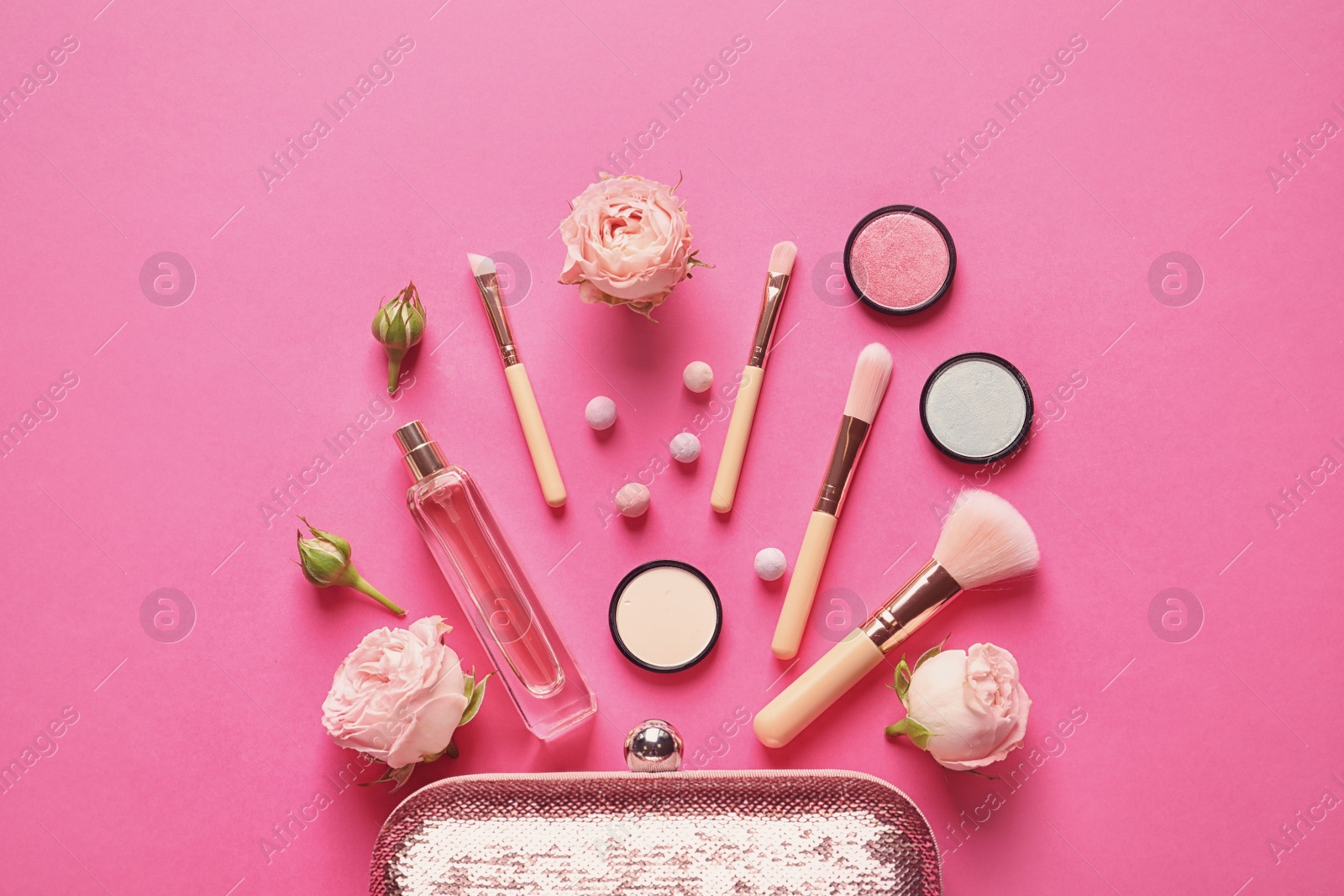 Photo of Flat lay composition with products for decorative makeup on pink background