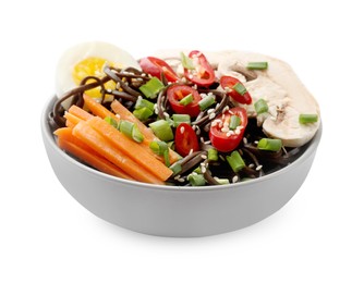 Photo of Tasty buckwheat noodles (soba) with chili pepper, carrot, egg and mushrooms in bowl isolated on white