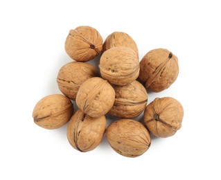 Whole walnuts in shell on white background, top view