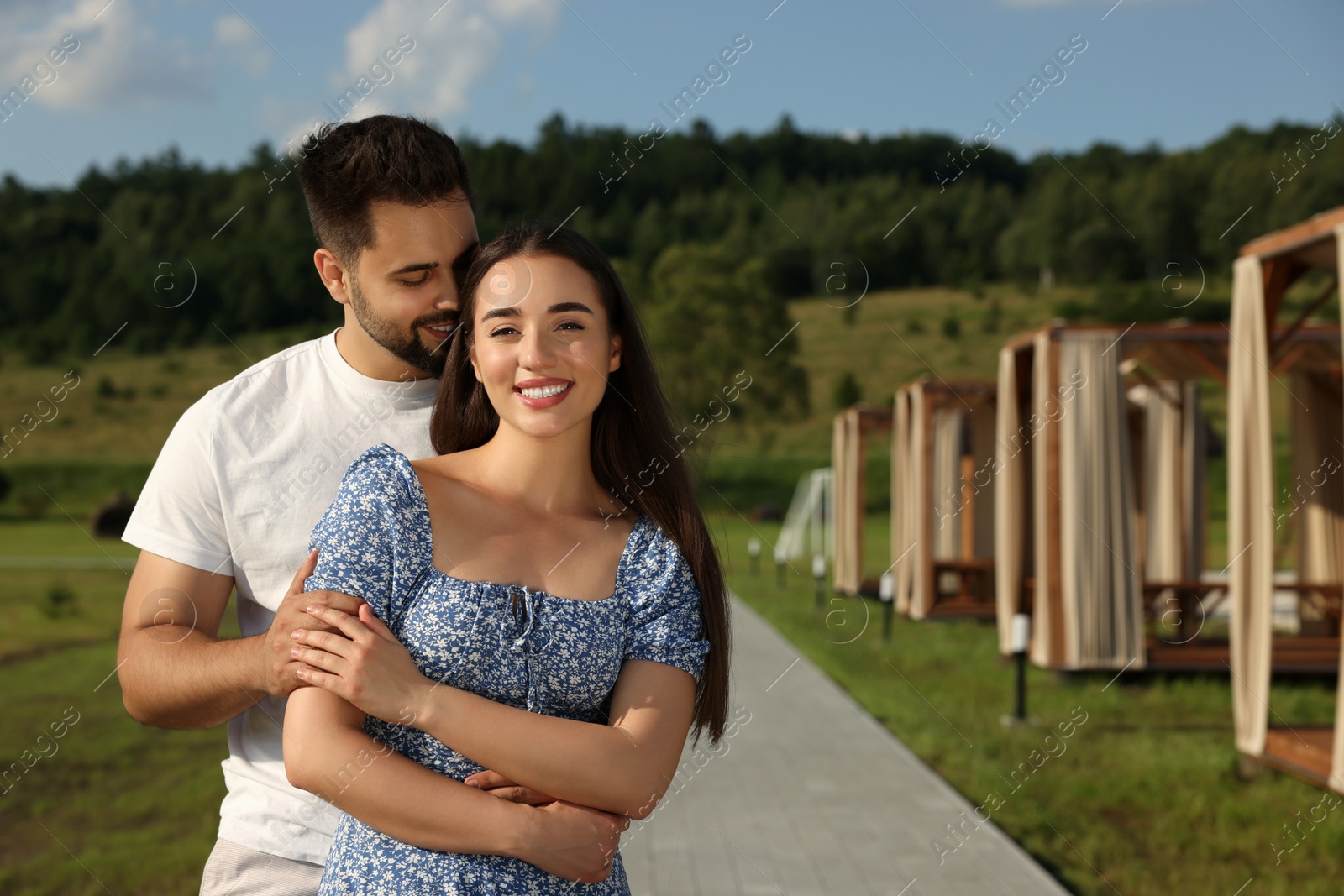 Photo of Romantic date. Beautiful couple spending time together outdoors, space for text