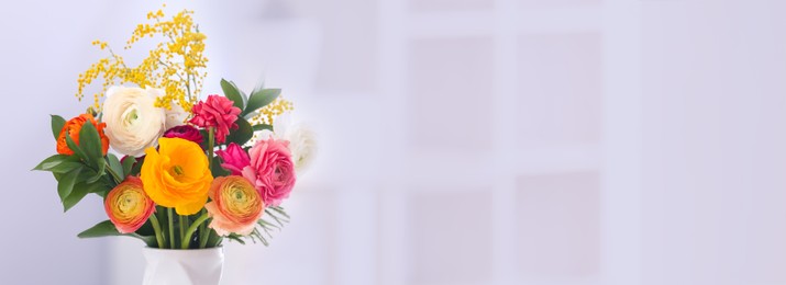 Image of Vase with beautiful ranunculus flowers on blurred background, space for text. Banner design