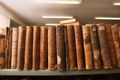 Image of Collection of old books on shelf in library