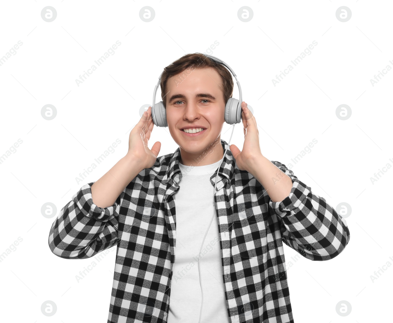 Photo of Handsome young man with headphones on white background