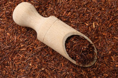 Rooibos tea and wooden scoop, top view