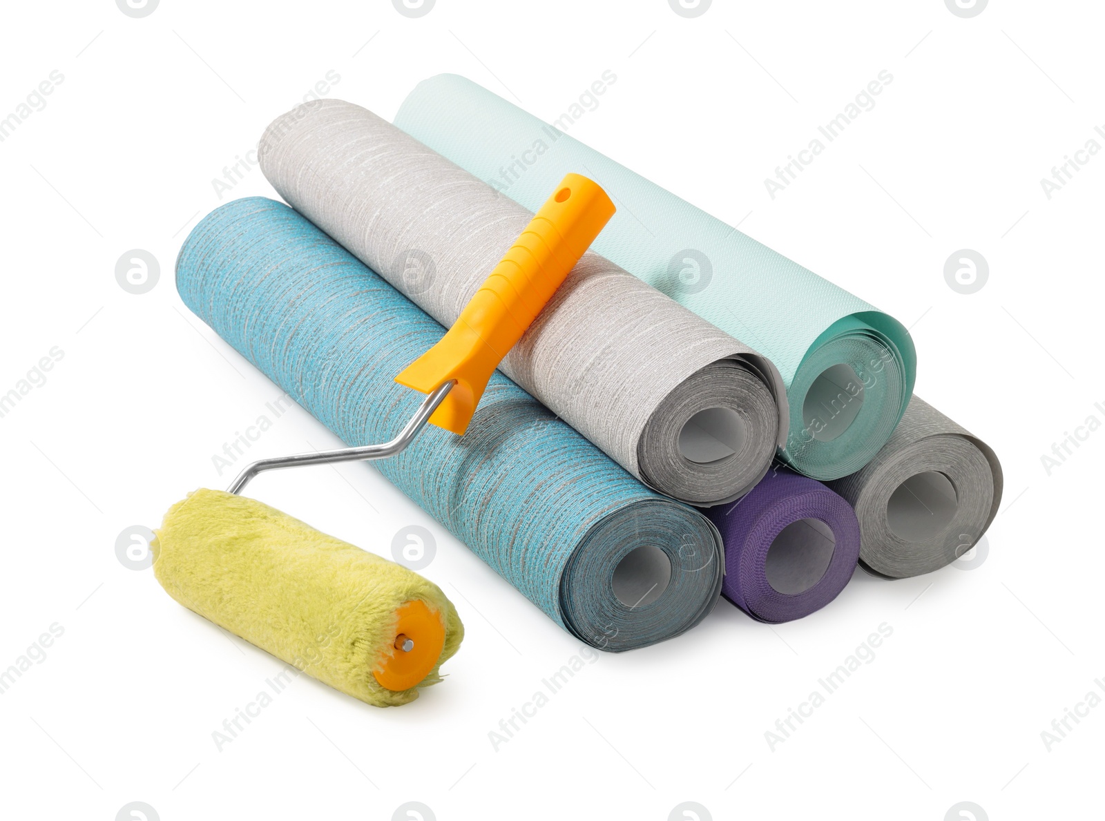 Photo of Different wallpaper rolls and roller isolated on white