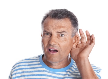 Photo of Mature man with hearing problem on white background