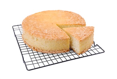 Photo of Baking rack with tasty sponge cake isolated on white