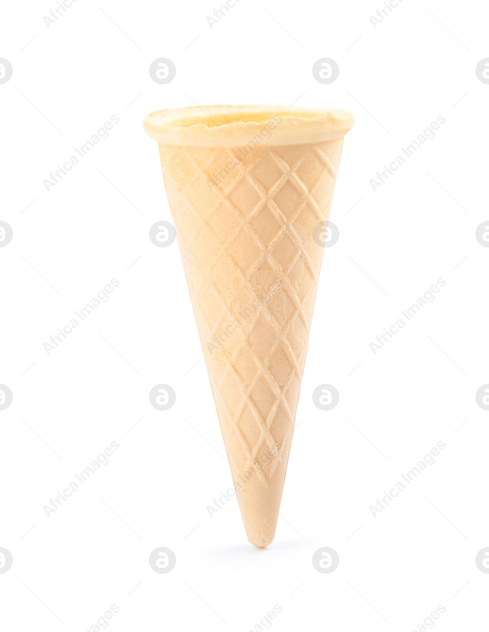 Photo of Empty crispy waffle cone for ice cream on white background