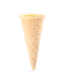 Photo of Empty crispy waffle cone for ice cream on white background