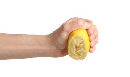 Woman squeezing lemon half on white background, closeup