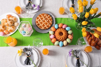 Festive Easter table setting with traditional meal, top view