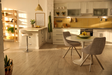 Photo of Modern kitchen interior with stylish white furniture