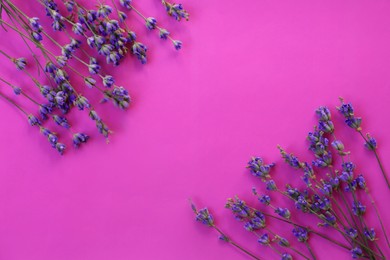 Flat lay composition with beautiful lavender flowers on purple background. Space for text