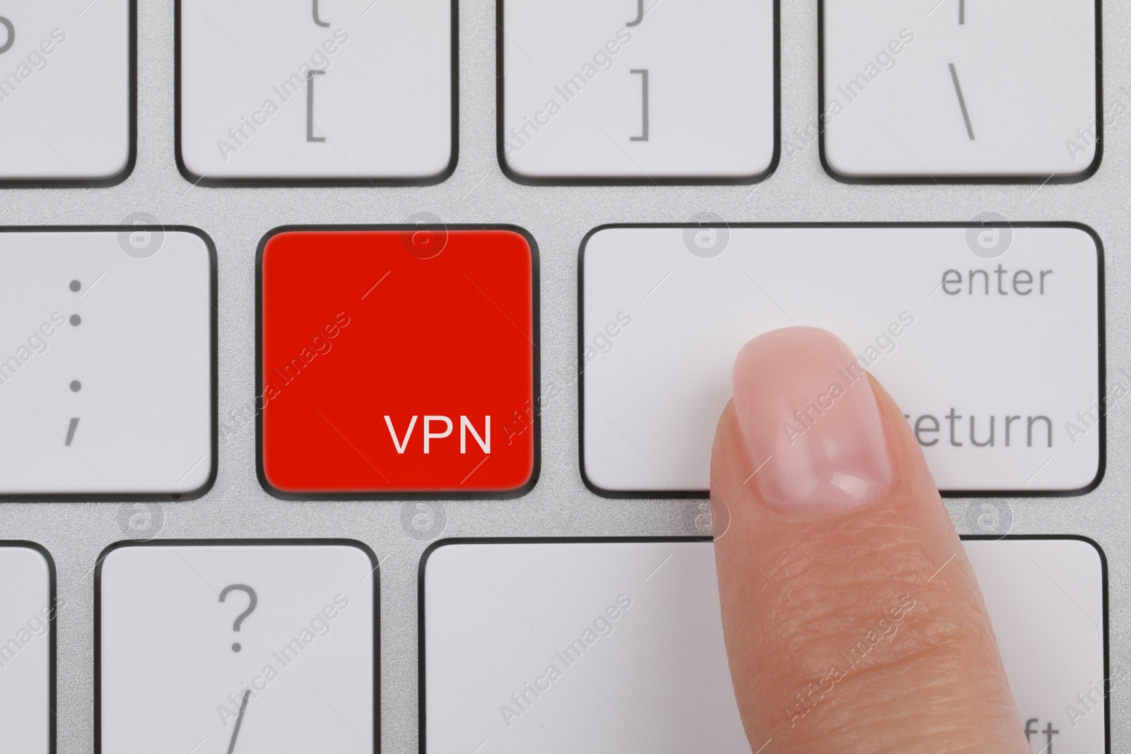 Image of VPN concept. Woman pressing button on computer keyboard, top view