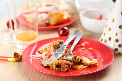 Photo of Food leftovers after party on wooden table, closeup