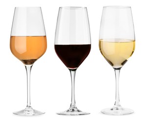 Image of Glasses of white, rose and red wine isolated on white