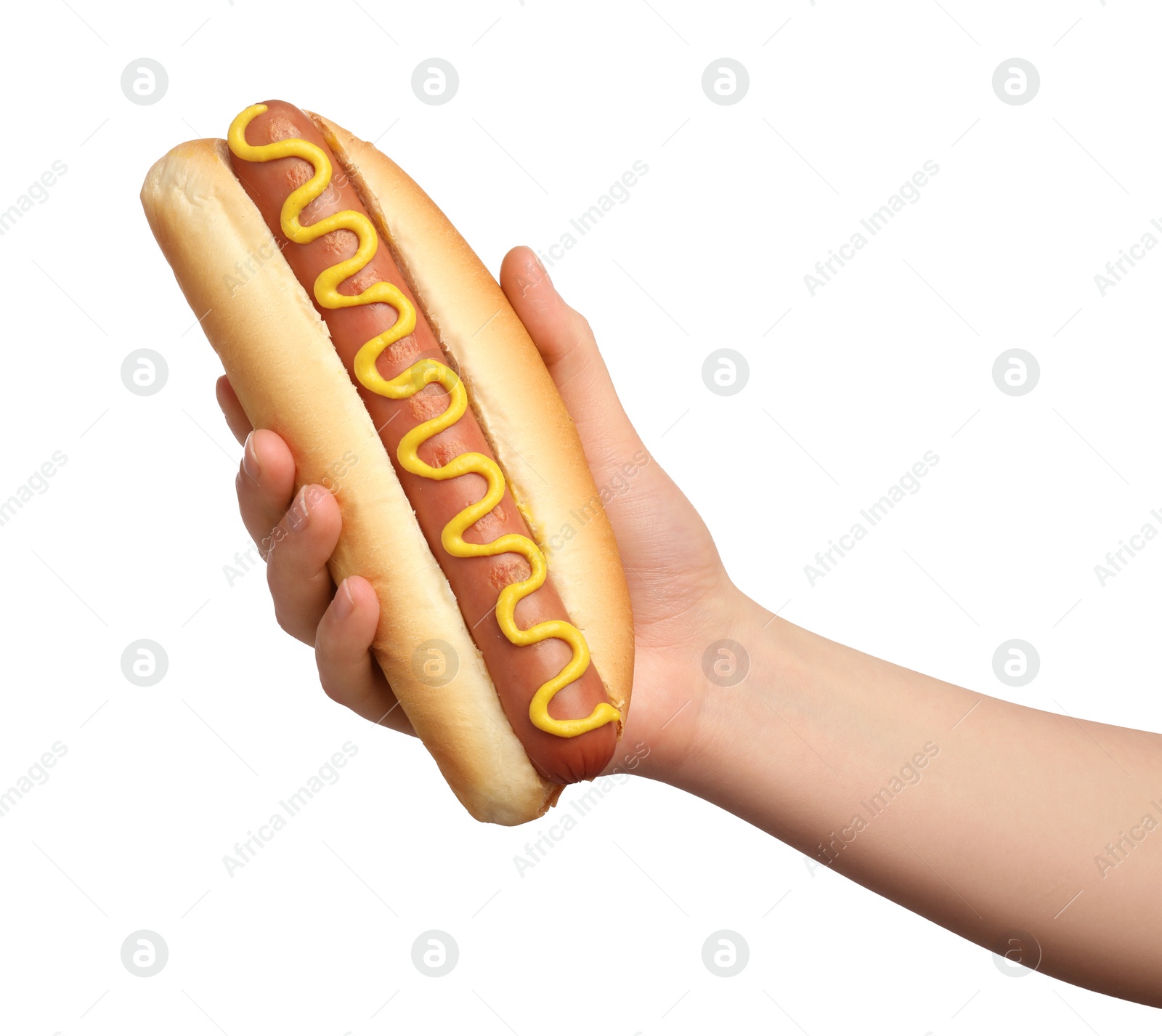 Photo of Woman holding delicious hot dog with mustard on white background, closeup