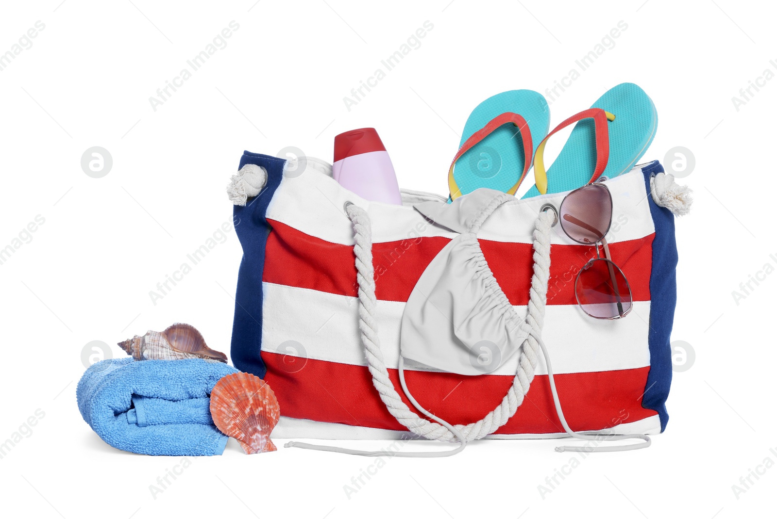 Photo of Stylish bag, sunscreen and other beach accessories isolated on white