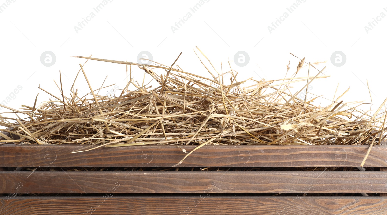 Photo of Dried straw in wooden crate isolated on white