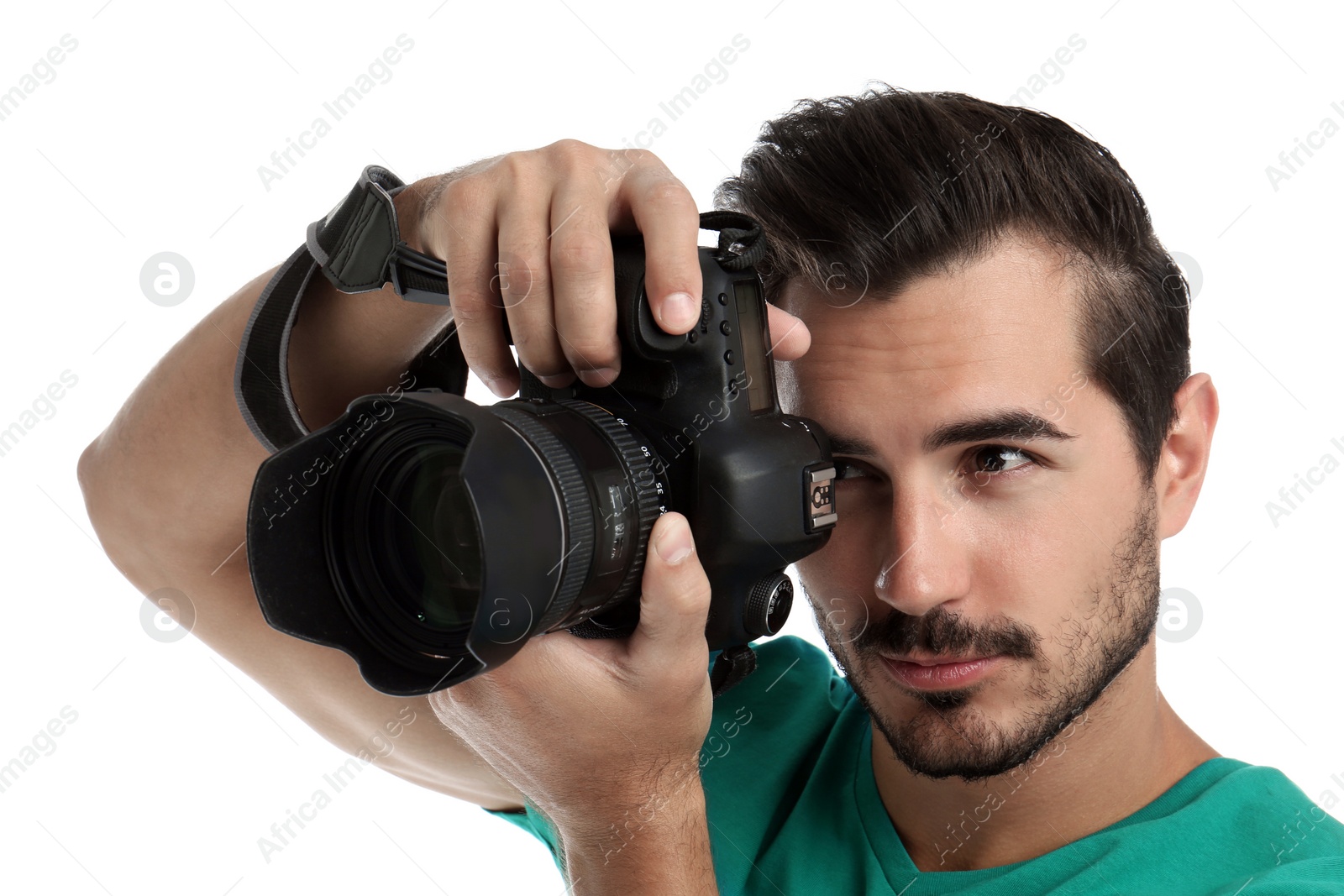 Photo of Young professional photographer taking picture on white background