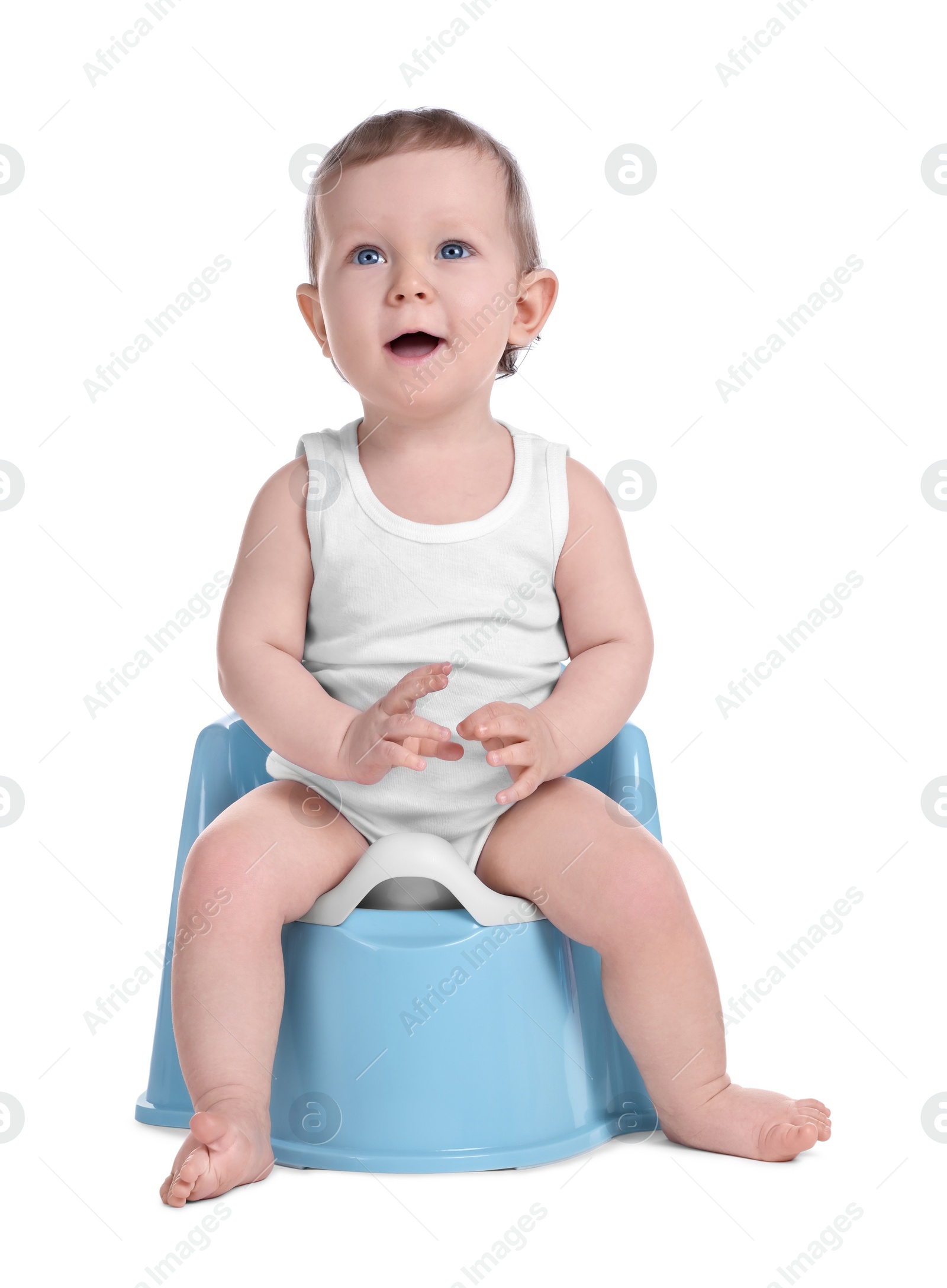 Photo of Little child sitting on baby potty against white background