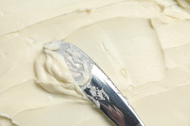 Photo of Closeup view of tasty butter and knife