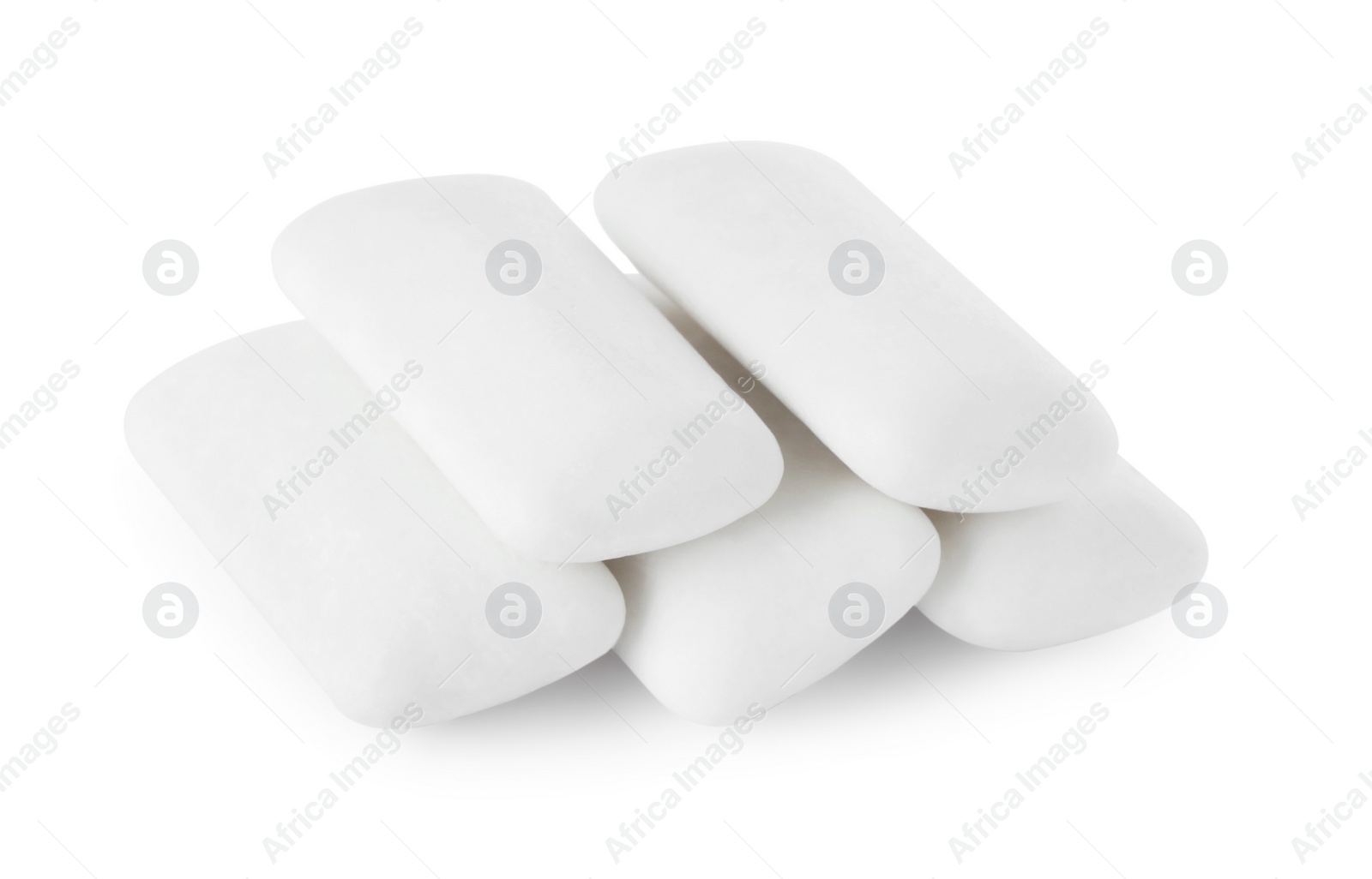 Photo of Pile of tasty chewing gums on white background