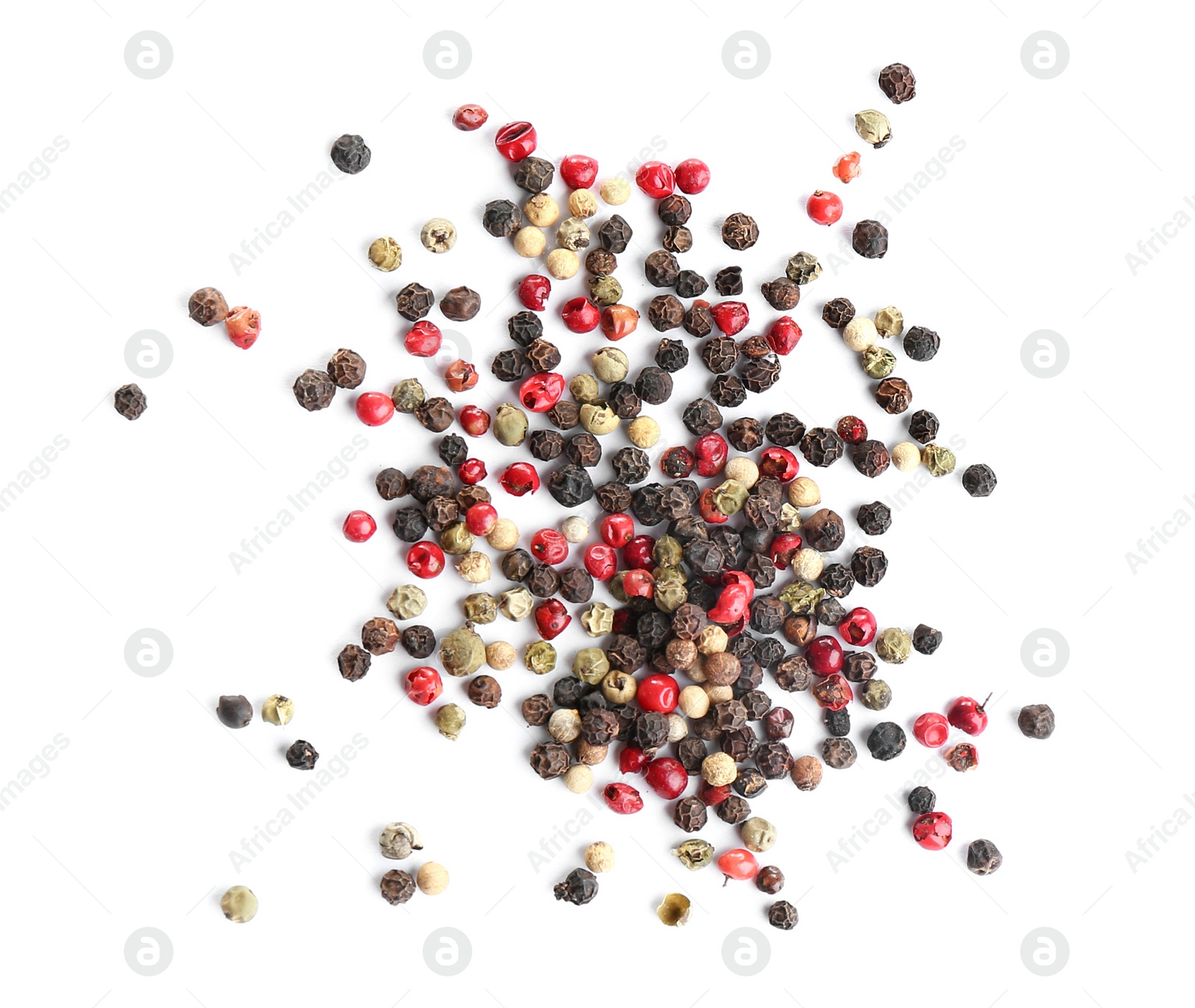 Photo of Heap of mixed peppercorns isolated on white, top view