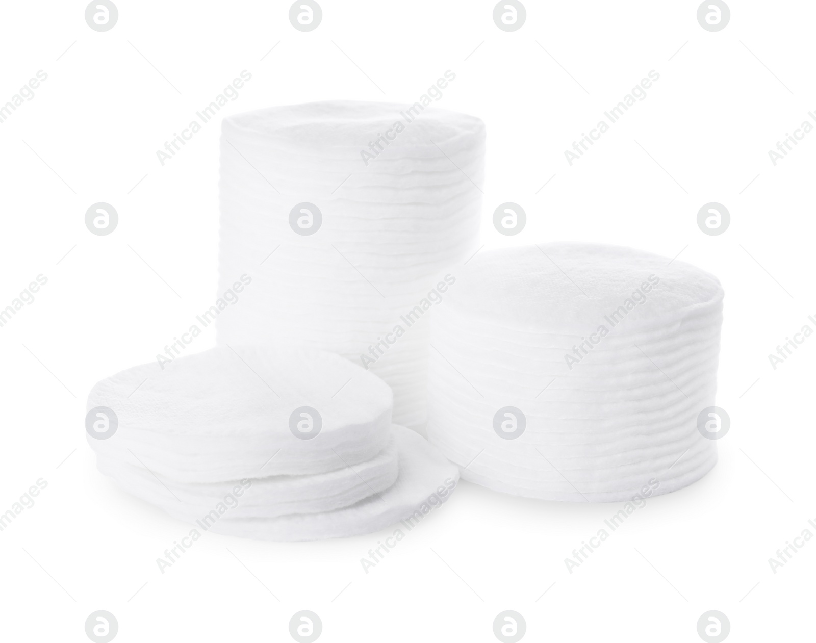 Photo of Stacks of cotton pads on white background