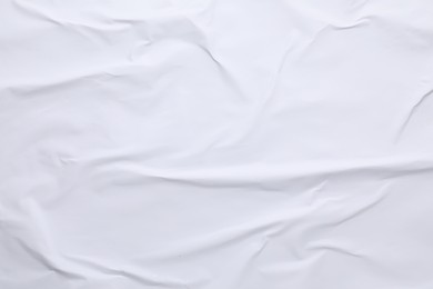 White crumpled sheet of paper as background, top view. Wall poster