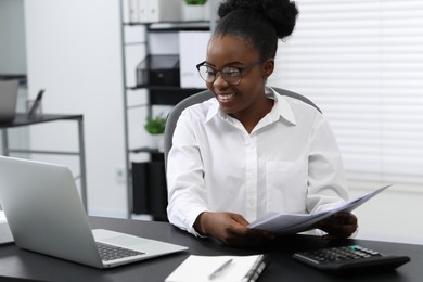 Professional accountant working at desk in office