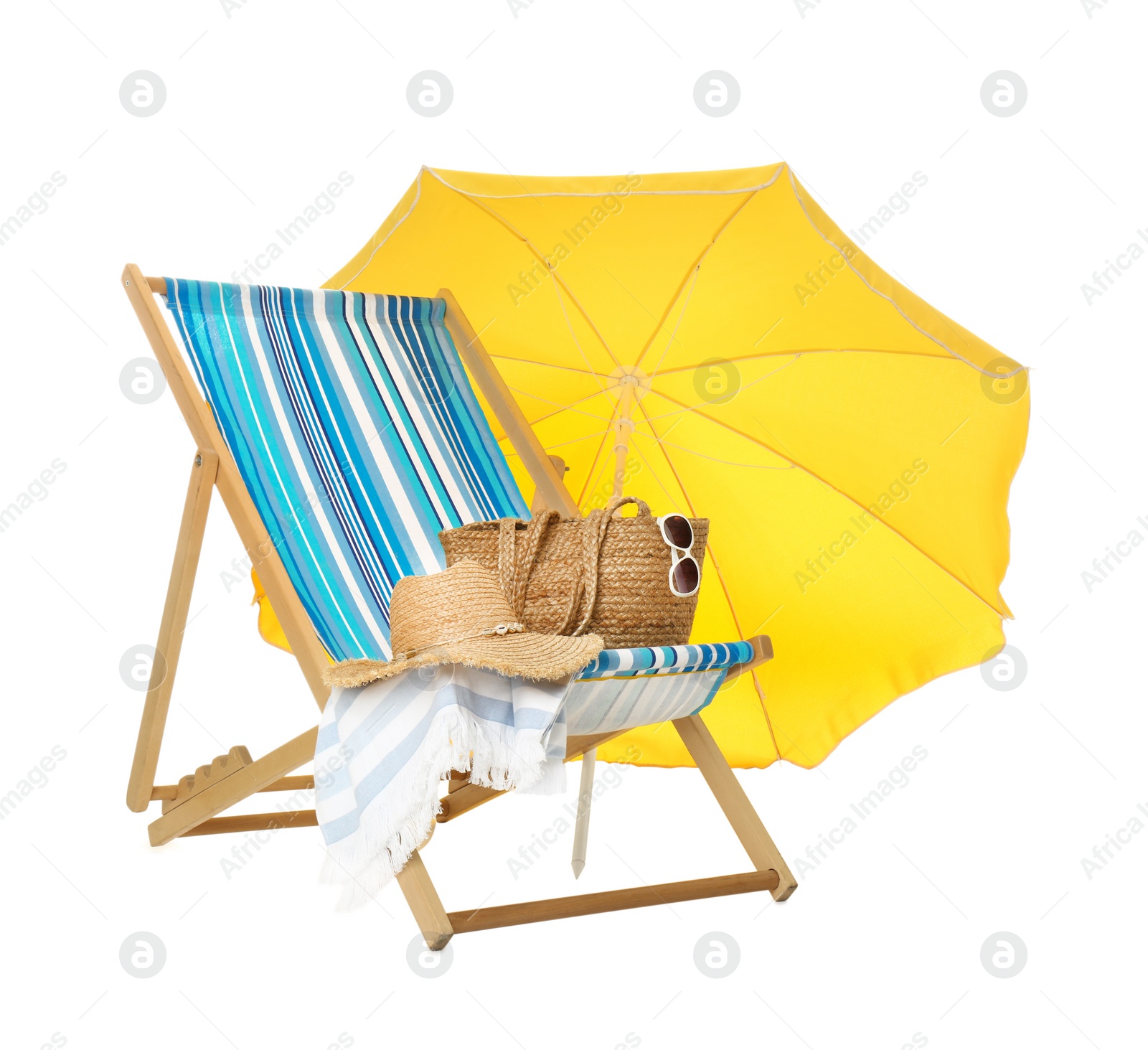 Photo of Open yellow beach umbrella, deck chair and accessories on white background