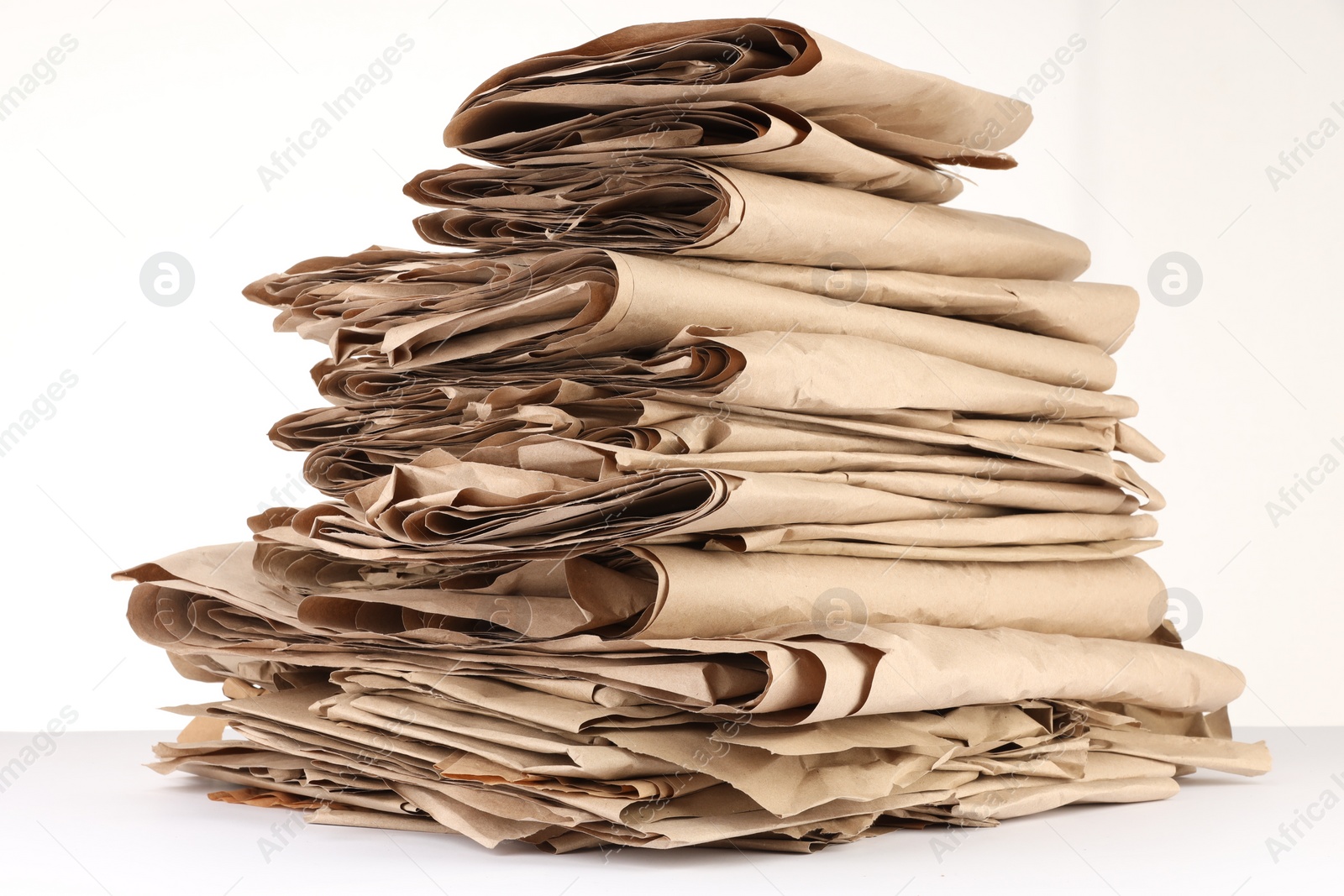 Photo of Stack of waste paper isolated on white