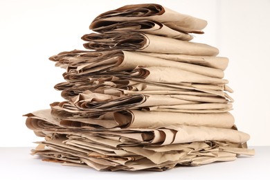 Photo of Stack of waste paper isolated on white