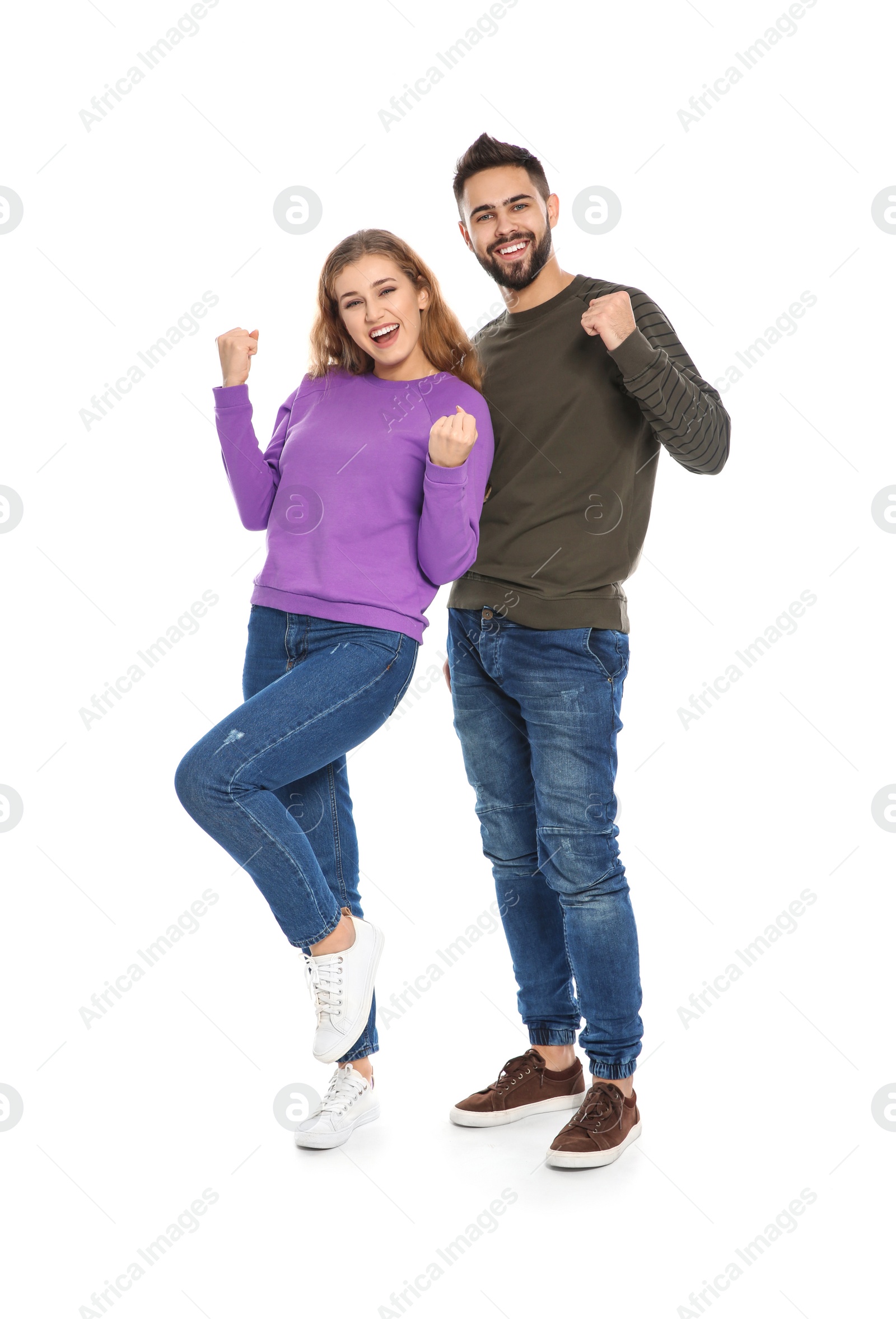 Photo of Happy young people celebrating victory on white background